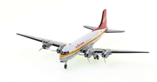 Front port side view of the Douglas DC-4 1/200 scale diecast model, of "Pacific Trader", registration VH-EDA in the Ochre livery of Qantas Airways - Herpa HE570855