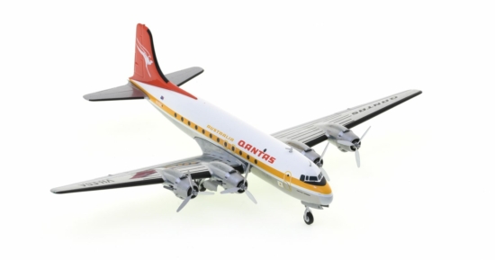 Front starboard side view of the Douglas DC-4 1/200 scale diecast model, of "Pacific Trader", registration VH-EDA in the Ochre livery of Qantas Airways - Herpa HE570855