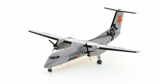 Front port side view of the 1/200 scale De Havilland Canada Dash 8-300 diecast model of  registration VH-SBI, Jetstar livery, circa the late 2000s - JC Wings JC2JST276