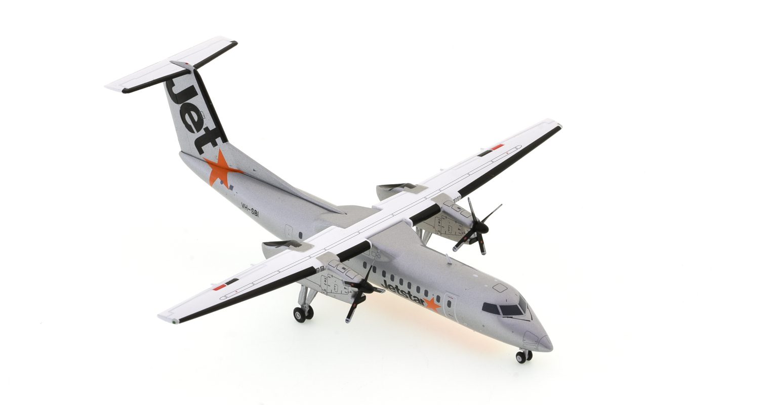 Front starboard side view of the 1/200 scale De Havilland Canada Dash 8-300 diecast model of  registration VH-SBI, Jetstar livery, circa the late 2000s - JC Wings JC2JST276