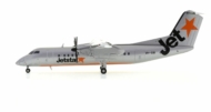 Port side view of the 1/200 scale De Havilland Canada Dash 8-300 diecast model of  registration VH-SBI, Jetstar livery, circa the late 2000s - JC Wings JC2JST276