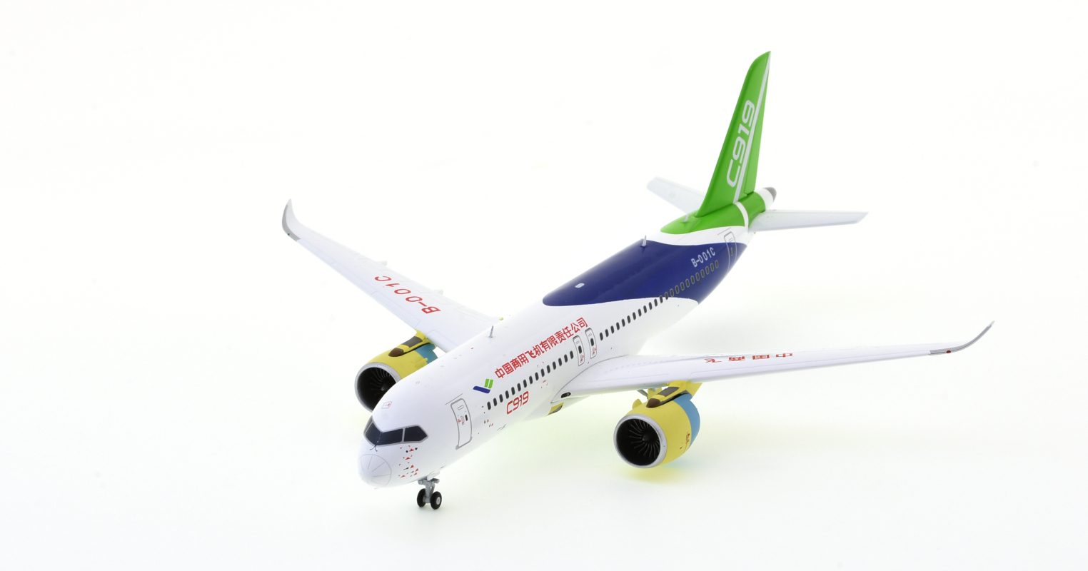 Front port side view of the 1/200 scale Comac C919 prototype diecast model, registration B-001C in Comac House Colours - JC Wings LH2COM225