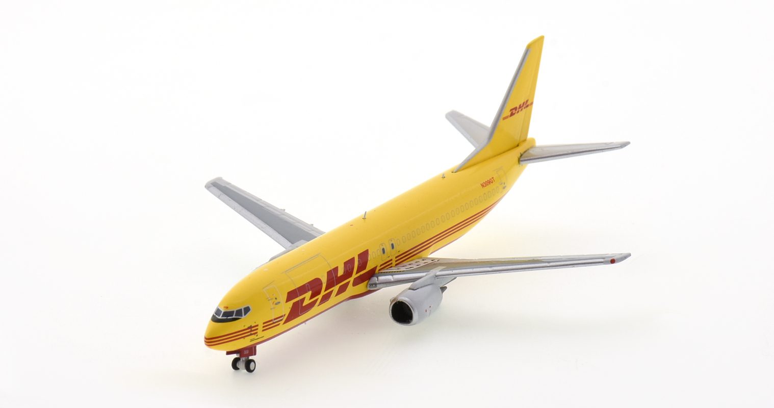 Front port side view of Panda Models PM202031 - 1/400 scale diecast model of the Boeing 737-400 SF registration N309GT in DHL Aviation's livery, circa 2020.