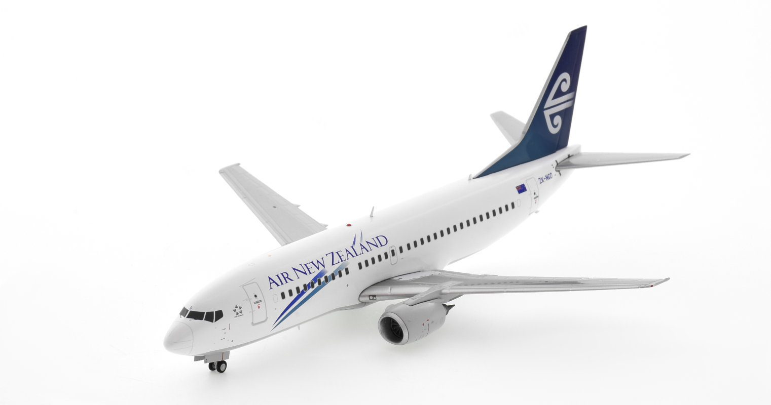Front port side view of JC Wings JC2ANZ0075 / XX20075 - 1/200 scale diecast model of the Boeing 737-300 registration ZK-NGD in Air New Zealand's 