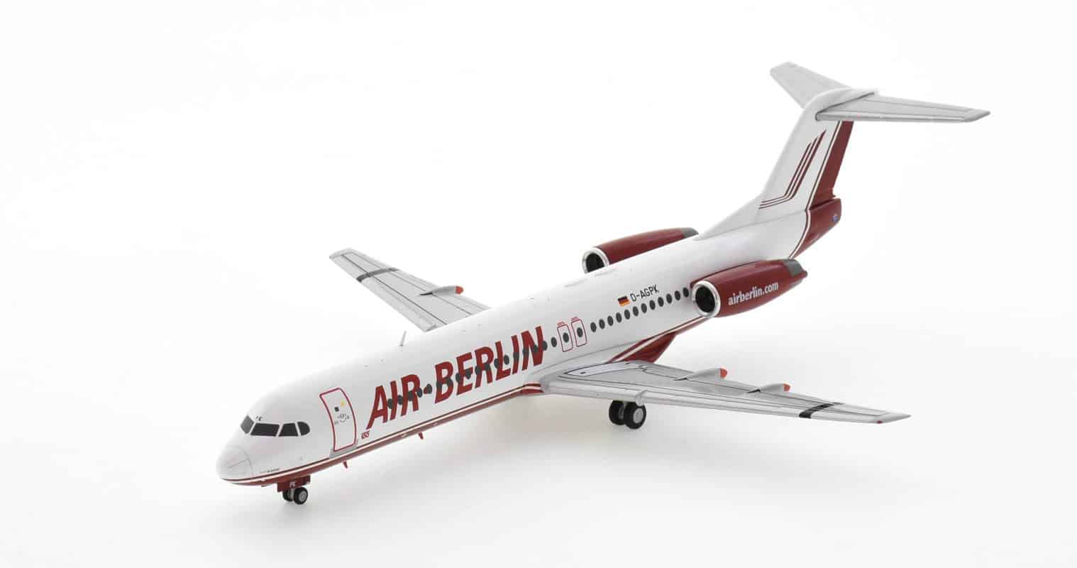 Front port side view of Herpa Wings HE571203 - 1/200 scale diecast model Fokker 100 (F28 Mark 0100), registration D-AGPK, in Air Berlin's livery.