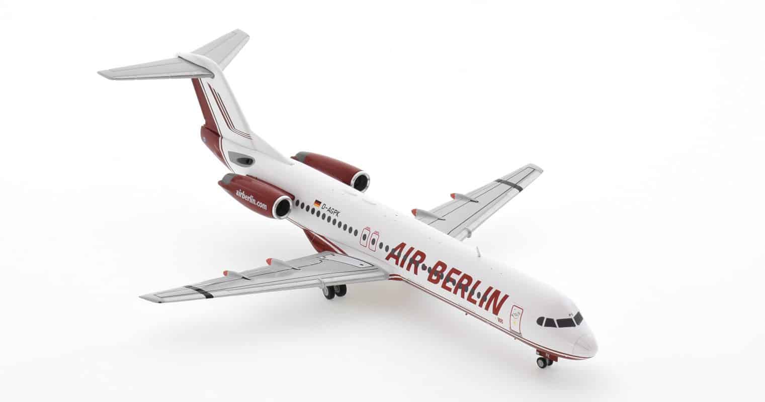 Front starboard side view of Herpa Wings HE571203 - 1/200 scale diecast model Fokker 100 (F28 Mark 0100), registration D-AGPK, in Air Berlin's livery.