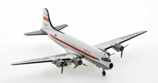 Front starboard side view of Herpa WingsHE571555 - 1/200 scale diecast model Douglas DC-4, registration VH-EDB, named "Norfolk Trader" in Qantas Airway's livery, circa the 1960s