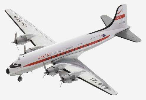 Top view of Herpa Wings HE571555 - 1/200 scale diecast model Douglas DC-4, registration VH-EDB, named "Norfolk Trader" in Qantas Airway's livery, circa the 1960s