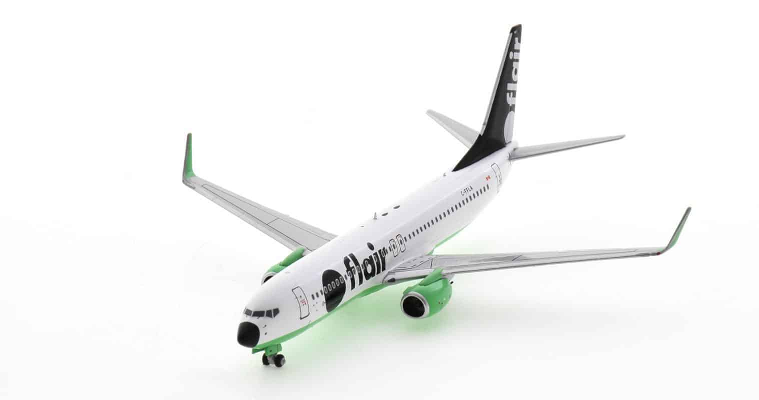 Front port side view of NG58113 - 1/200 scale diecast model Boeing 737-800, registration C-FFLA, in Flair Airline's livery.