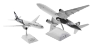 Image of model on display stand, JC Wings JC2ANZ0031 / XX20031 - 1/200 scale diecast model Boeing 777-200ER registration ZK-OKG in Air New Zealand's "Silver Fern" livery.