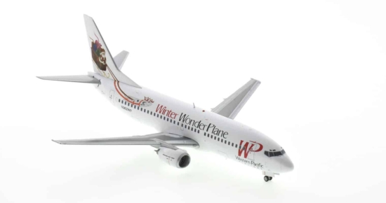 Front starboard view of JC Wings JC2KMR0109 / XX20109 - 1/200 scale diecast model Boeing 737-300 registration N962WP in Western Pacific Airlines livery with "Winter Wonder Plane" titles, circa 1996.