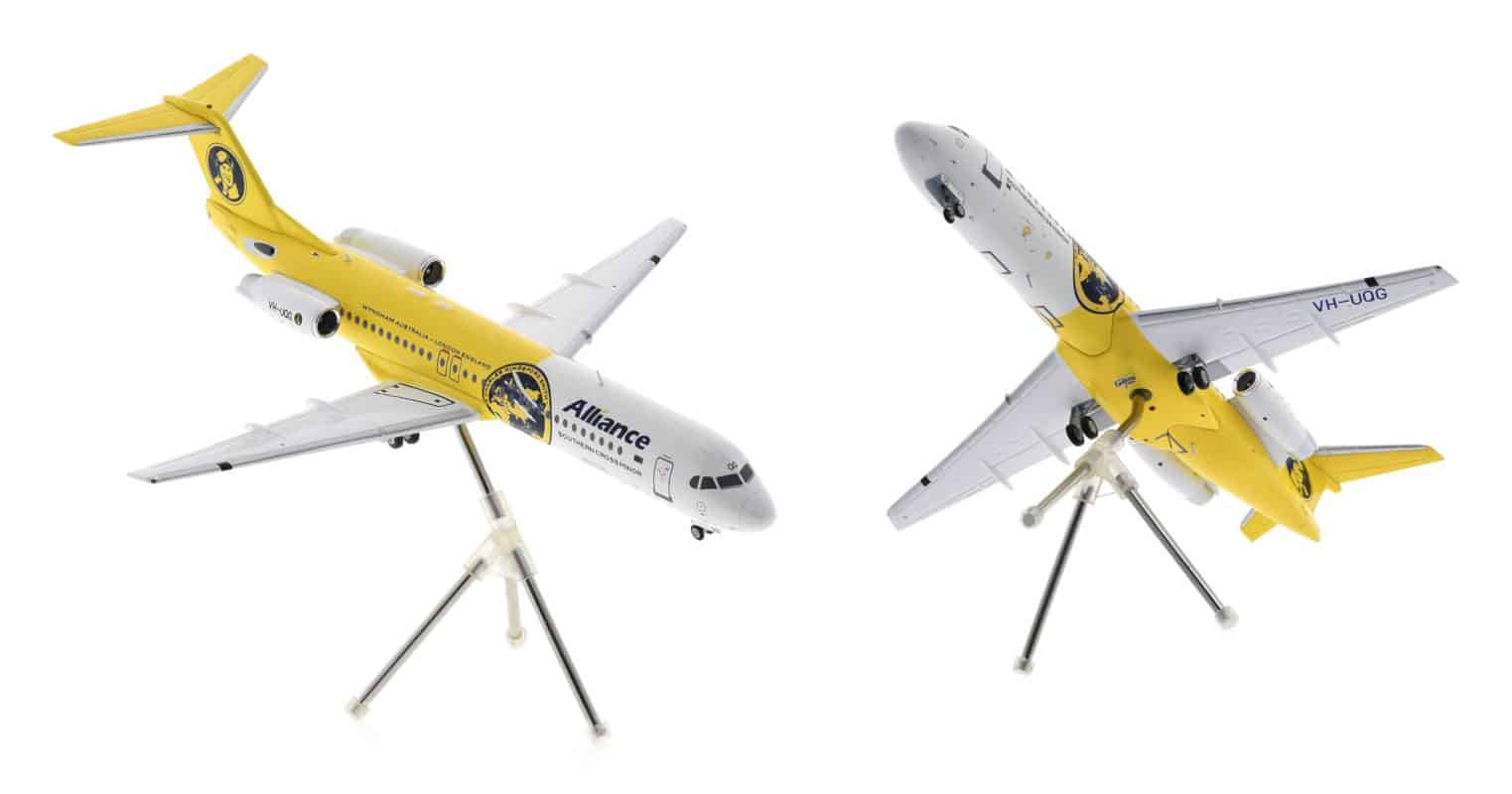 Image showing model on display stand, Gemini Jets G2UTY987 - 1/200 scale diecast model of the Fokker 100, registration VH-UQG in Alliance Airlines 