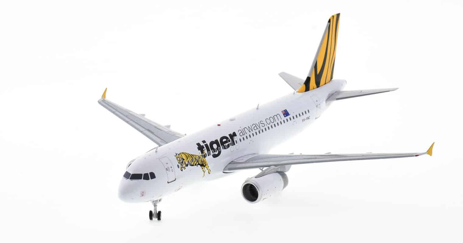 Front port side view of JC Wings IF320TT0721 - 1/200 scale diecast model Airbus A320-200  of registration VH-VNH, Tigerair Australia