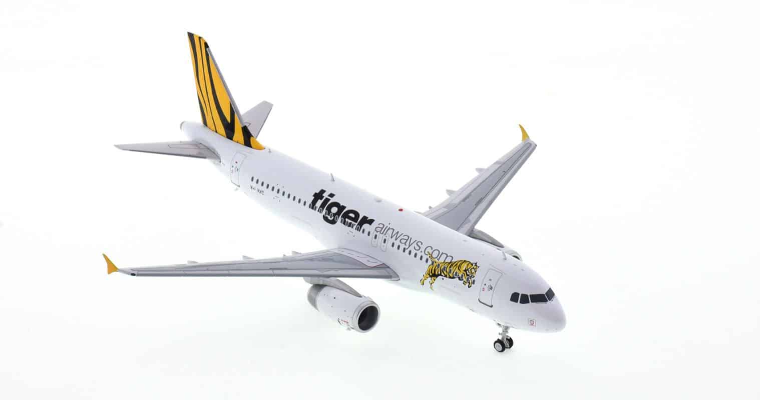 Front starboard side view of JC Wings IF320TT0721 - 1/200 scale diecast model Airbus A320-200  of registration VH-VNH, Tigerair Australia
