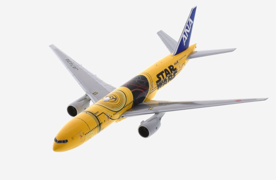 Top view of the 1/200 scale diecast model Boeing 777-200ER of registration JA743A in All Nippon Airways (ANA) Star Wars "C-3PO" livery - JC Wings EW2772005