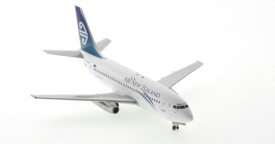 Front starboard side view of the 1/200 scale diecast model Boeing 737-200 registration ZK-NQC named "Piopio" in Air New Zealand "Pacific Wave" livery, circa 2000 - Inflight200 IF732NZ0922
