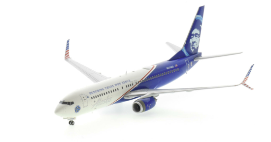 Front port side view of the 1/200 scale diecast model Boeing 737-800 NG, registration N570AS, in Alaska Airline's “Honoring Those Who Serve" livery - Gemini Jets G2ASA1138