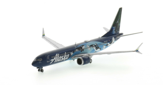Front port side view of the 1/400 scale diecast model Boeing 737-9 MAX registration N932AK in Alaska Airlines' "WEST COAST WONDERS - ORCAS" livery - Gemini Jets GJASA2078