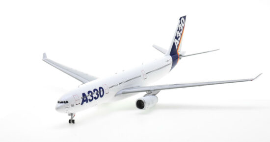 Front port side view of the 1/200 scale diecast model of the Airbus A330-300 prototype, registration F-WWKA in Airbus 'House Colours" circa the early 1990s - Inflight200 IF333AIRBUSKA