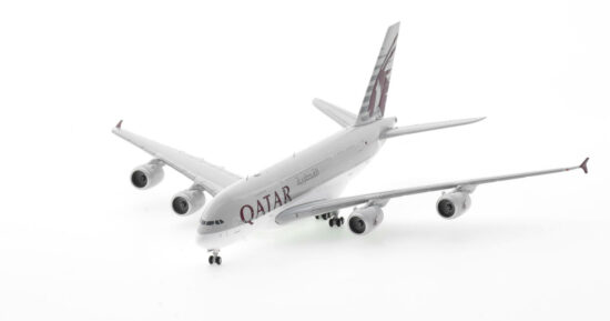 Front port side view of the 1/400 scale diecast model of the Airbus A380-800, registration A7-APJ in Qatar Airways livery -JC4QTR0047 / XX40047