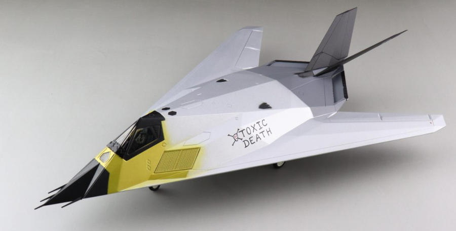 Front port side view of the 1/72 scale diecast model Lockheed F-117A Nighthawk, serial number 80-10781 "Toxic Death" of the 410th TS, 412th TW, USAF, 1991 - HA5810