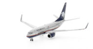 Front port side view of the 1/200 scale diecast model of the Boeing 737-700 NG, registration XA-GAM, in AeroMexico livery - 777028